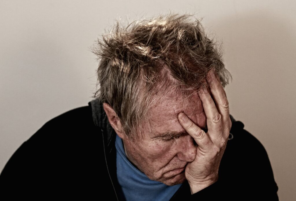 Stressed man thinking about the effects of lead on his health