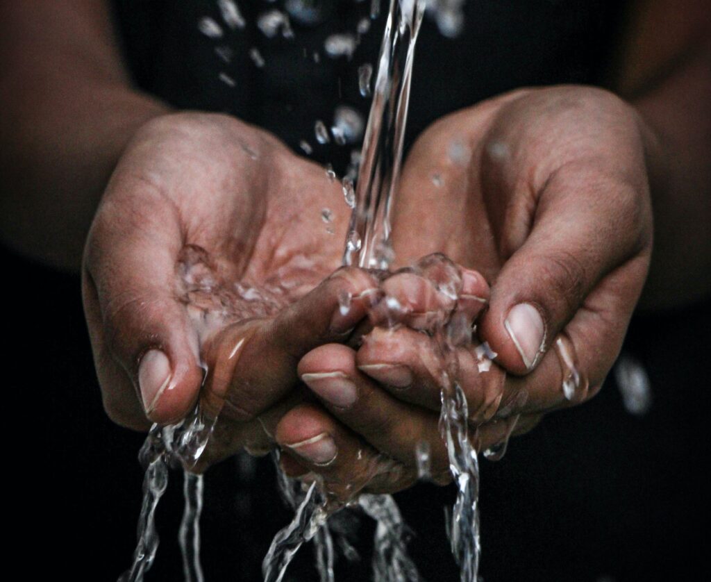 water running through two hands